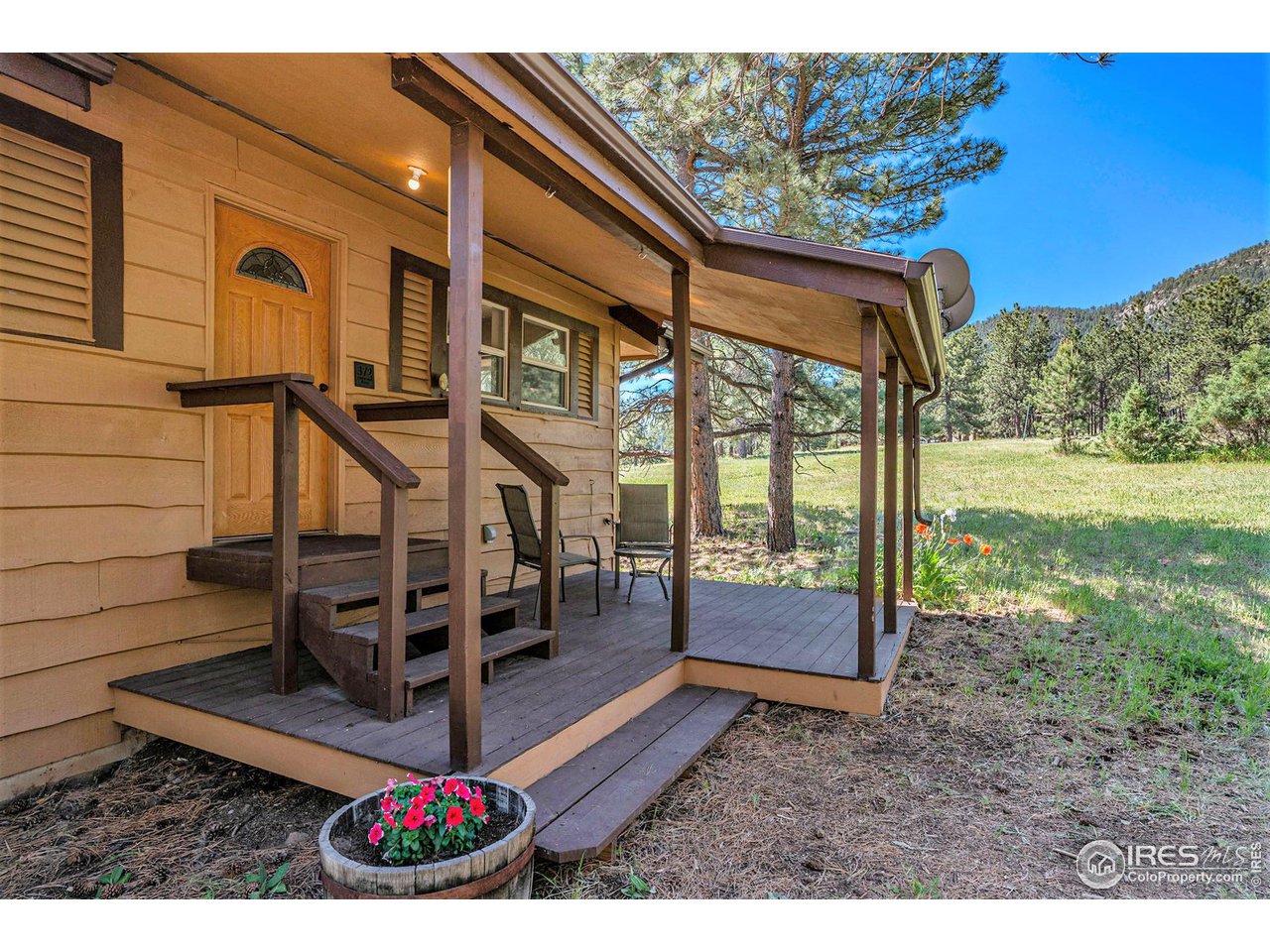 372 Cherokee Road Lyons, CO 80540 - Photo 25 of 33 a view of a porch with furniture and a yard