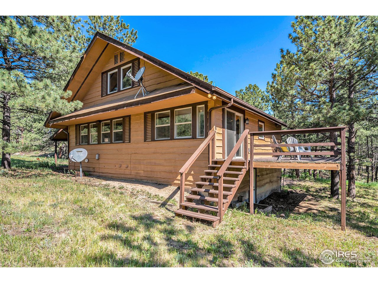 372 Cherokee Road Lyons, CO 80540 - Photo 28 of 33 a front view of a house with a yard