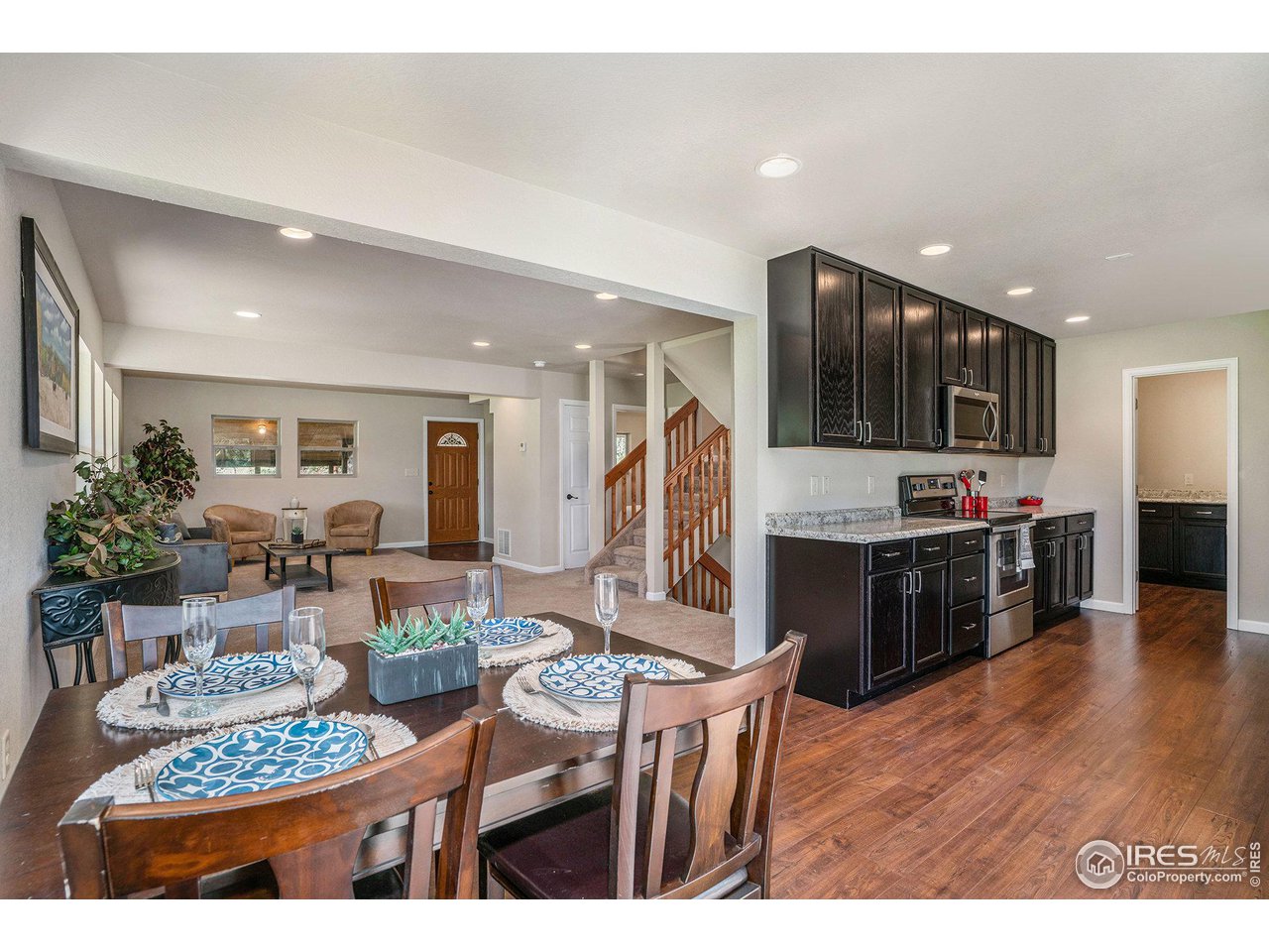 372 Cherokee Road Lyons, CO 80540 - Photo 7 of 33 a living room with stainless steel appliances kitchen island granite countertop furniture and a view of kitchen