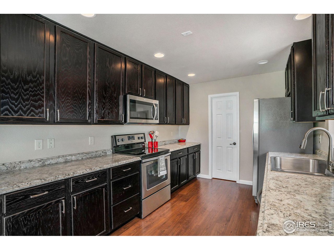 372 Cherokee Road Lyons, CO 80540 - Photo 8 of 33 a kitchen with stainless steel appliances granite countertop a sink stove and cabinets