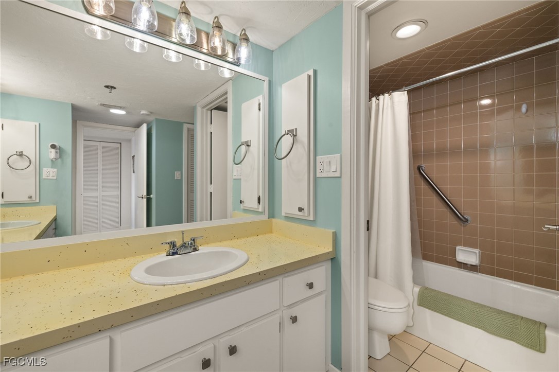 3170 Matecumbe Key Road, Unit 134 Punta Gorda, FL 33955 - Photo 20 of 31 a bathroom with a sink a toilet and shower