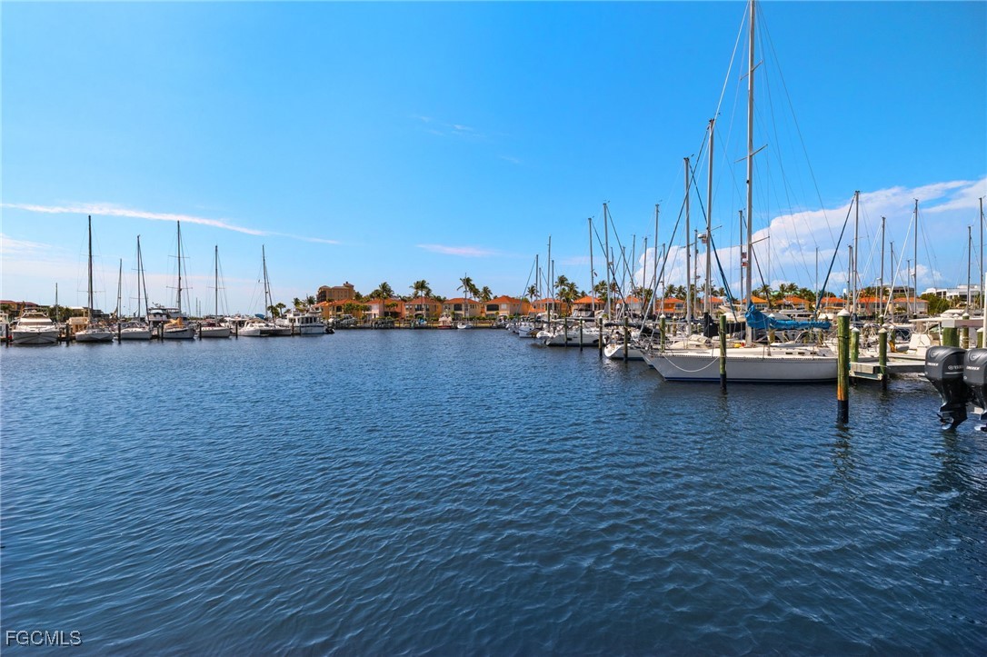 3170 Matecumbe Key Road, Unit 134 Punta Gorda, FL 33955 - Photo 31 of 31 a view of a ocean with boats and palm trees