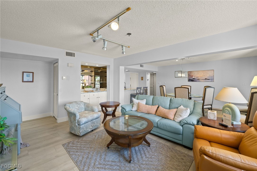 3170 Matecumbe Key Road, Unit 134 Punta Gorda, FL 33955 - Photo 5 of 31 a living room with furniture and a large window