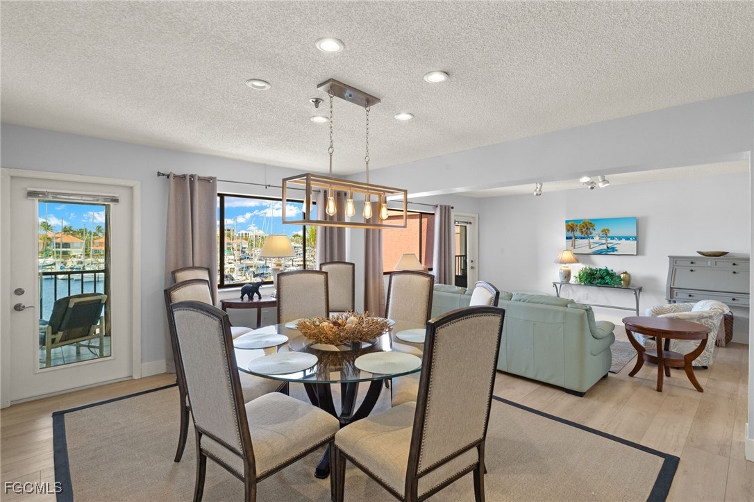 3170 Matecumbe Key Road, Unit 134 Punta Gorda, FL 33955 - Photo 7 of 31 a dining room with furniture and window