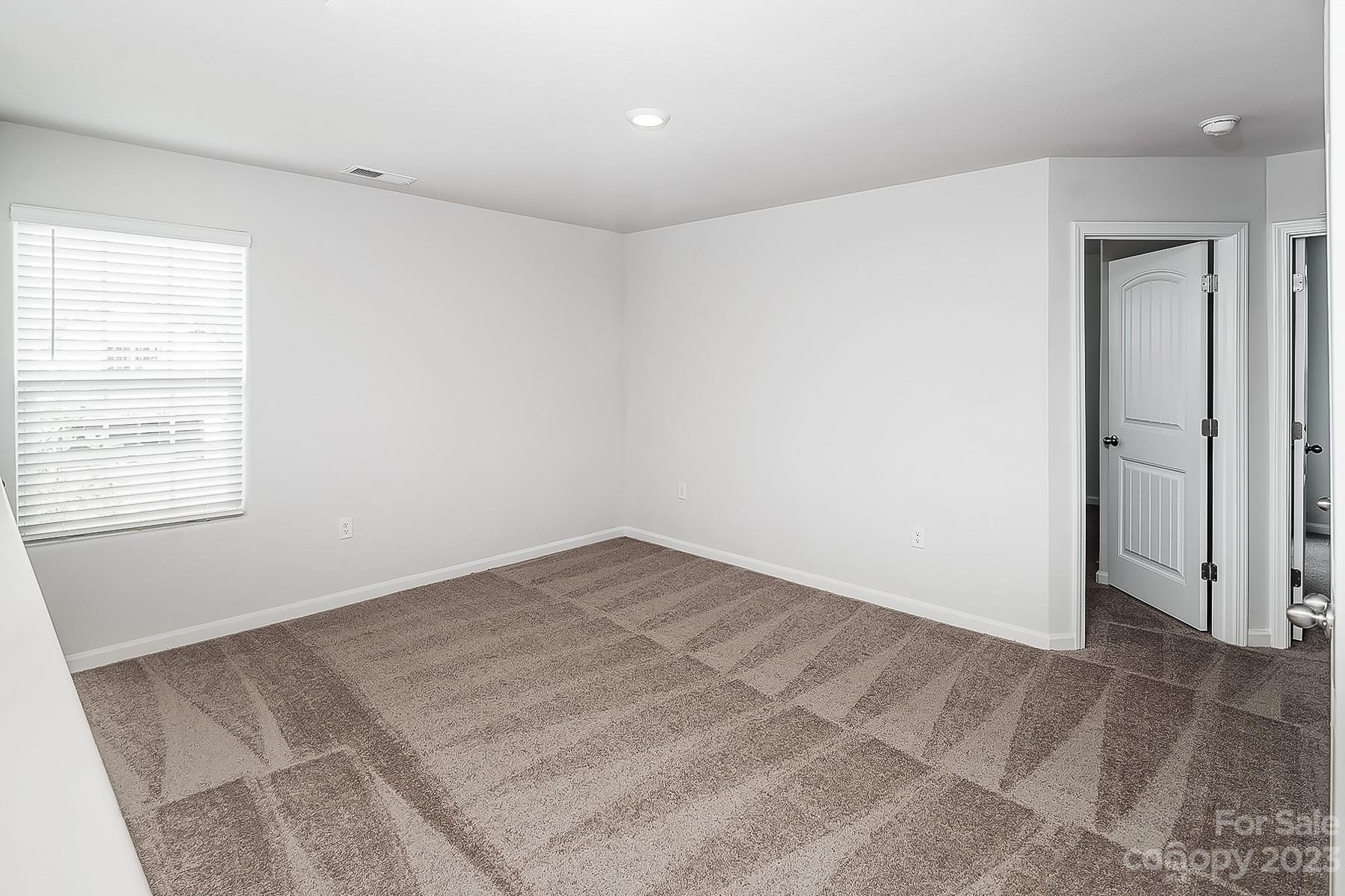 1341 Nia Road Charlotte, NC 28215 - Photo 7 of 15 an empty room with a natural light