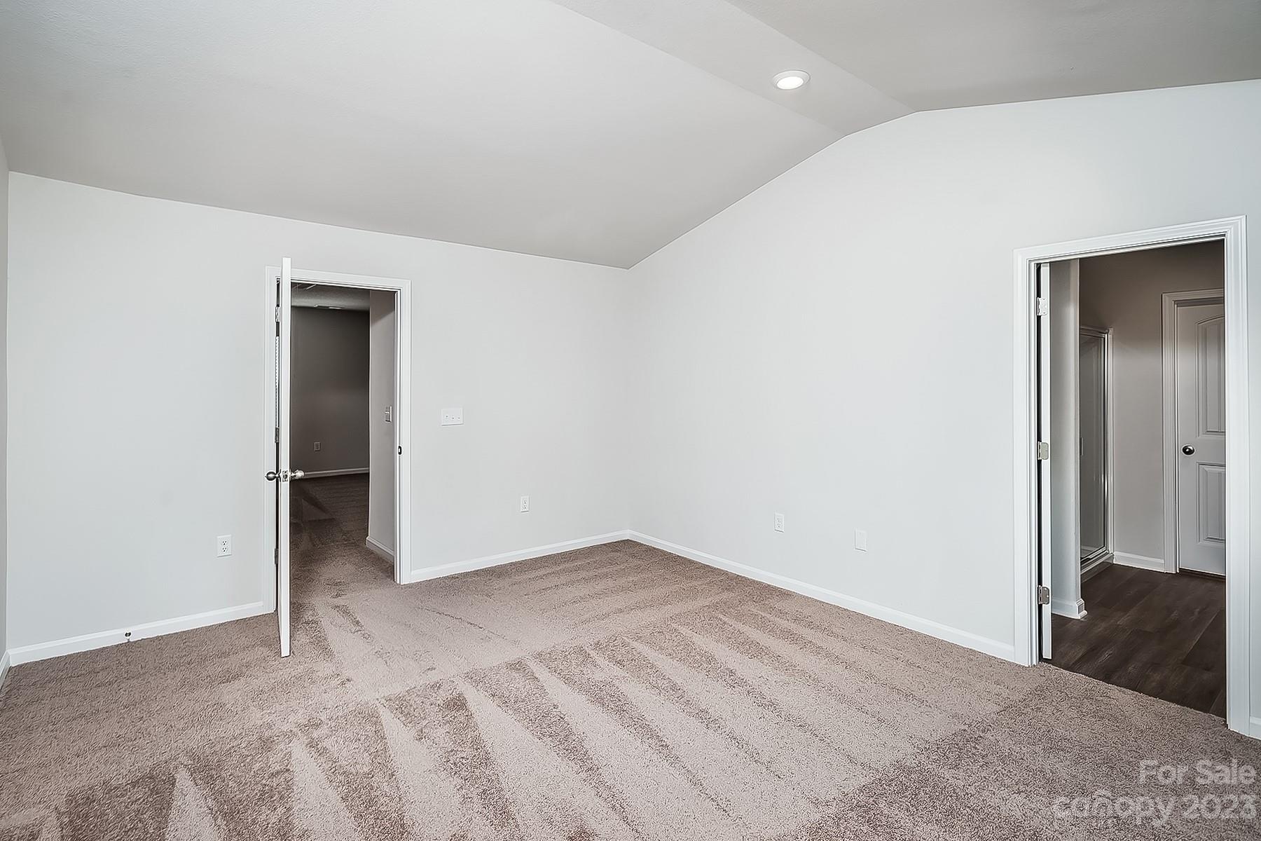 1341 Nia Road Charlotte, NC 28215 - Photo 10 of 15 an empty room with closet and a bathroom