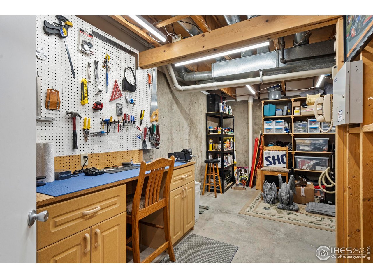 1213 Centennial Road Fort Collins, CO 80525 - Photo 20 of 29 Workshop in the unfinished space in the basement.