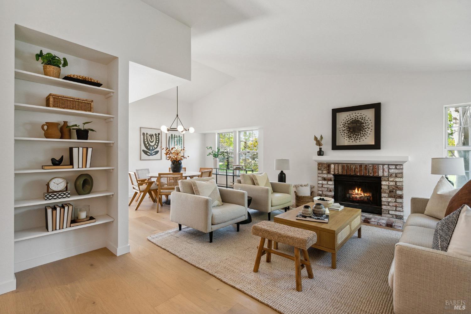 21 Hyannis Cove San Rafael, CA 94901 - Photo 1 of 1 a living room with furniture a rug and a fireplace