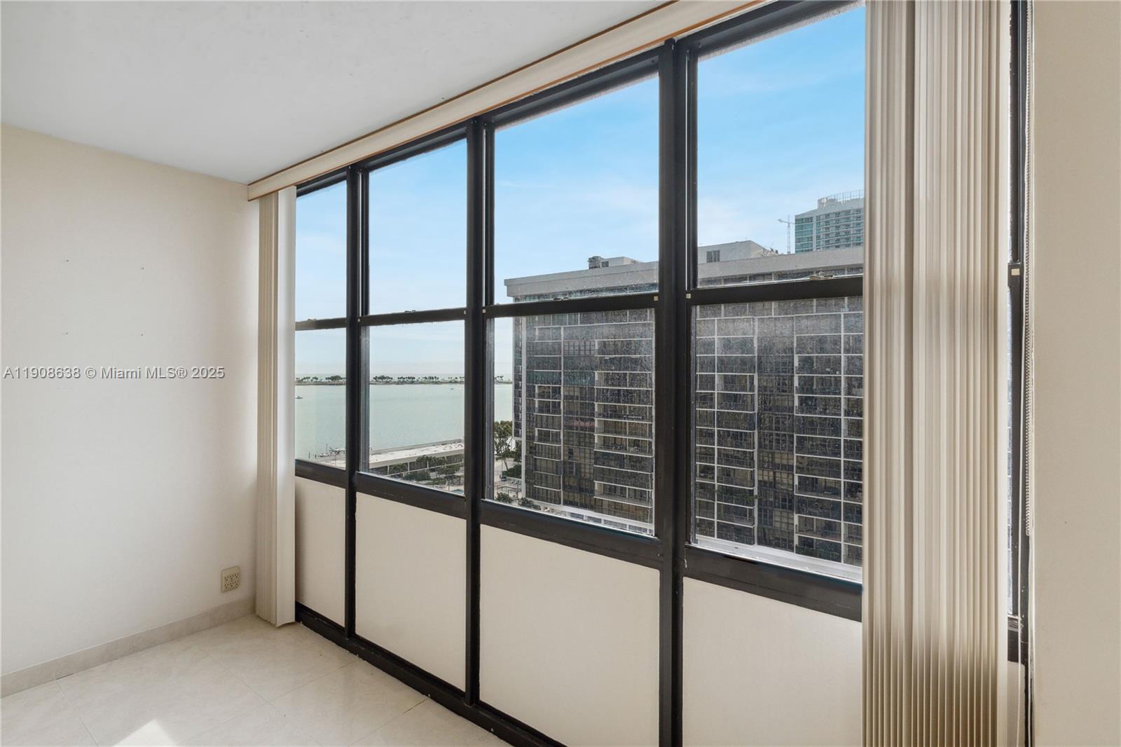 1901 Brickell Avenue, Unit B1408 Miami, FL 33129 - Photo 13 of 37 a view of a glass door with a window
