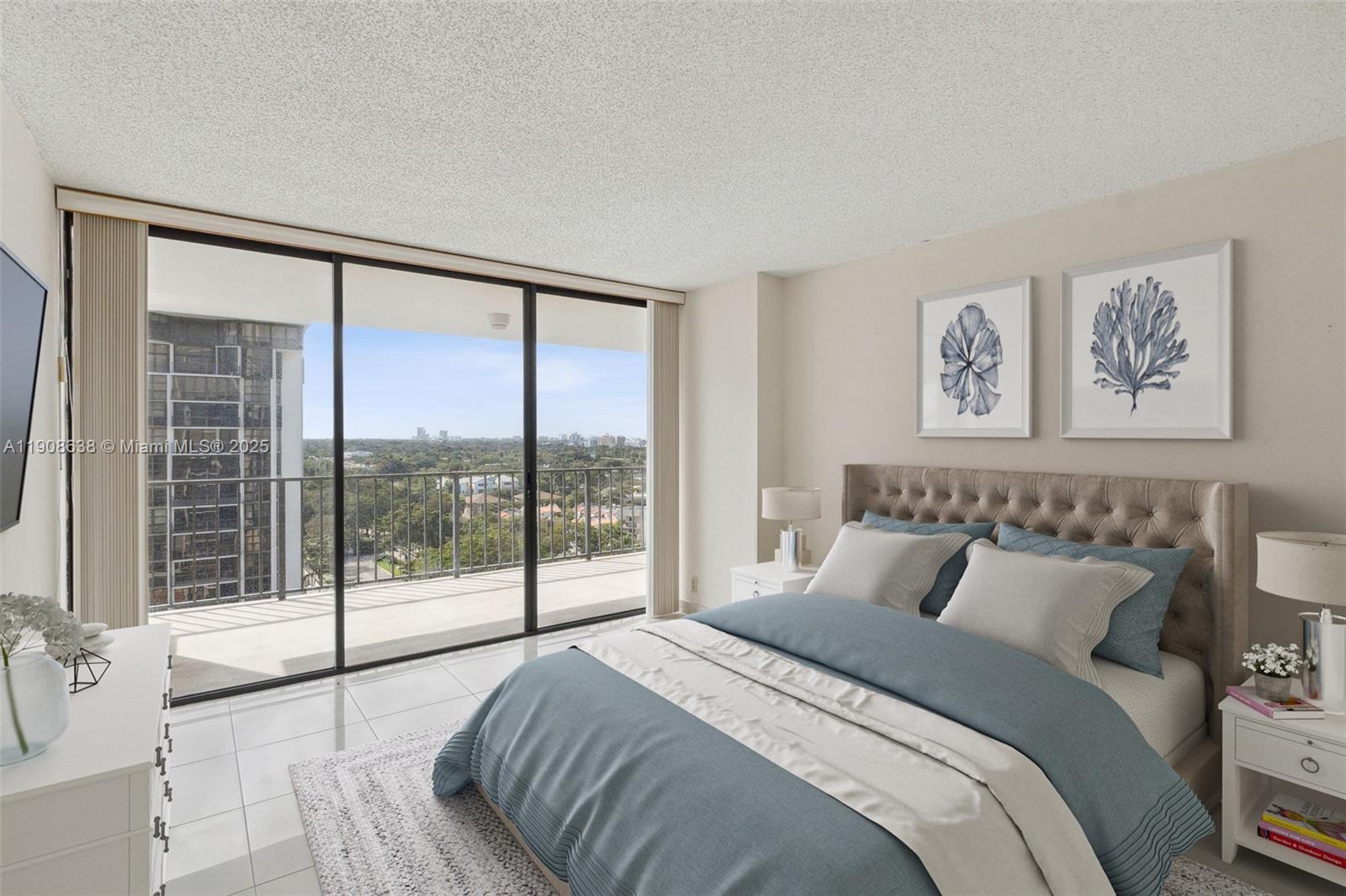 1901 Brickell Avenue, Unit B1408 Miami, FL 33129 - Photo 17 of 37 a bedroom with a large bed and a large window