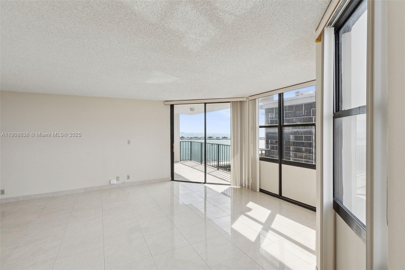 1901 Brickell Avenue, Unit B1408 Miami, FL 33129 - Photo 23 of 37 a view of an empty room with a window
