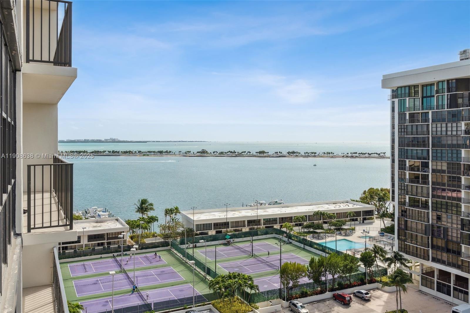 1901 Brickell Avenue, Unit B1408 Miami, FL 33129 - Photo 3 of 37 a view of a lake with couches and city view