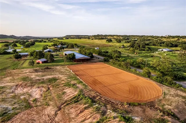 an aerial view of residential houses with outdoor space