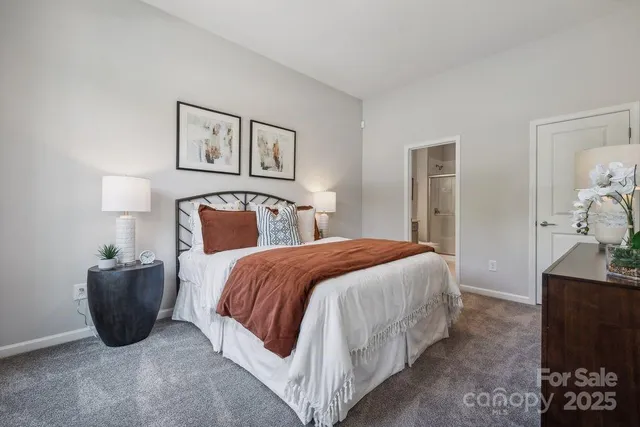 a living room with furniture a rug and a window