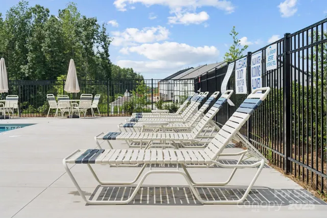 a view of a balcony with chairs