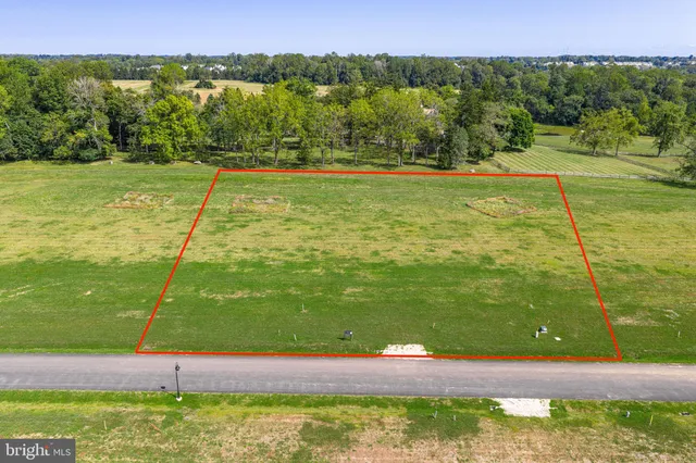 a view of a green field with clear sky