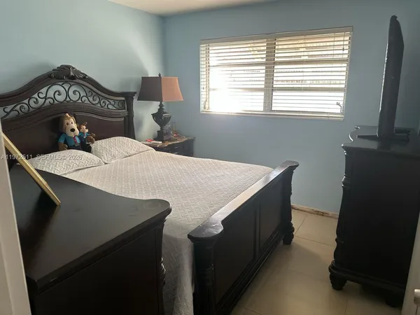 a kitchen with a sink cabinets and a window