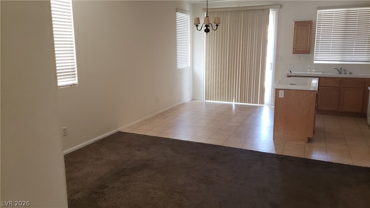 9112 Manalang Road Las Vegas, NV 89123 - Photo 50 of 50 An open floor plan seamlessly connects the kitchen and living spaces, perfect for everyday living.