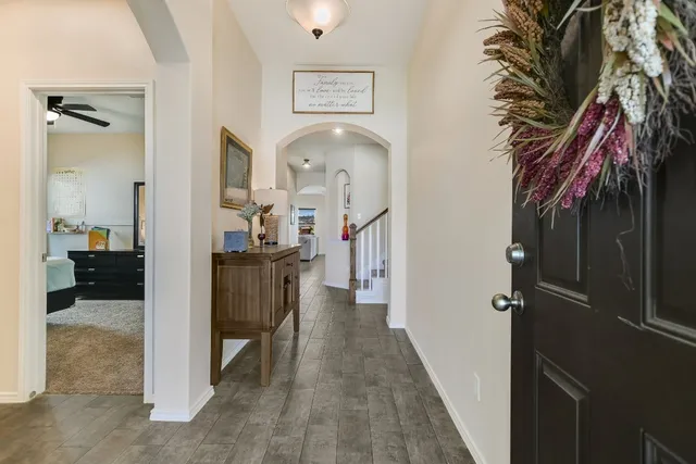 a view of a hallway with dining area