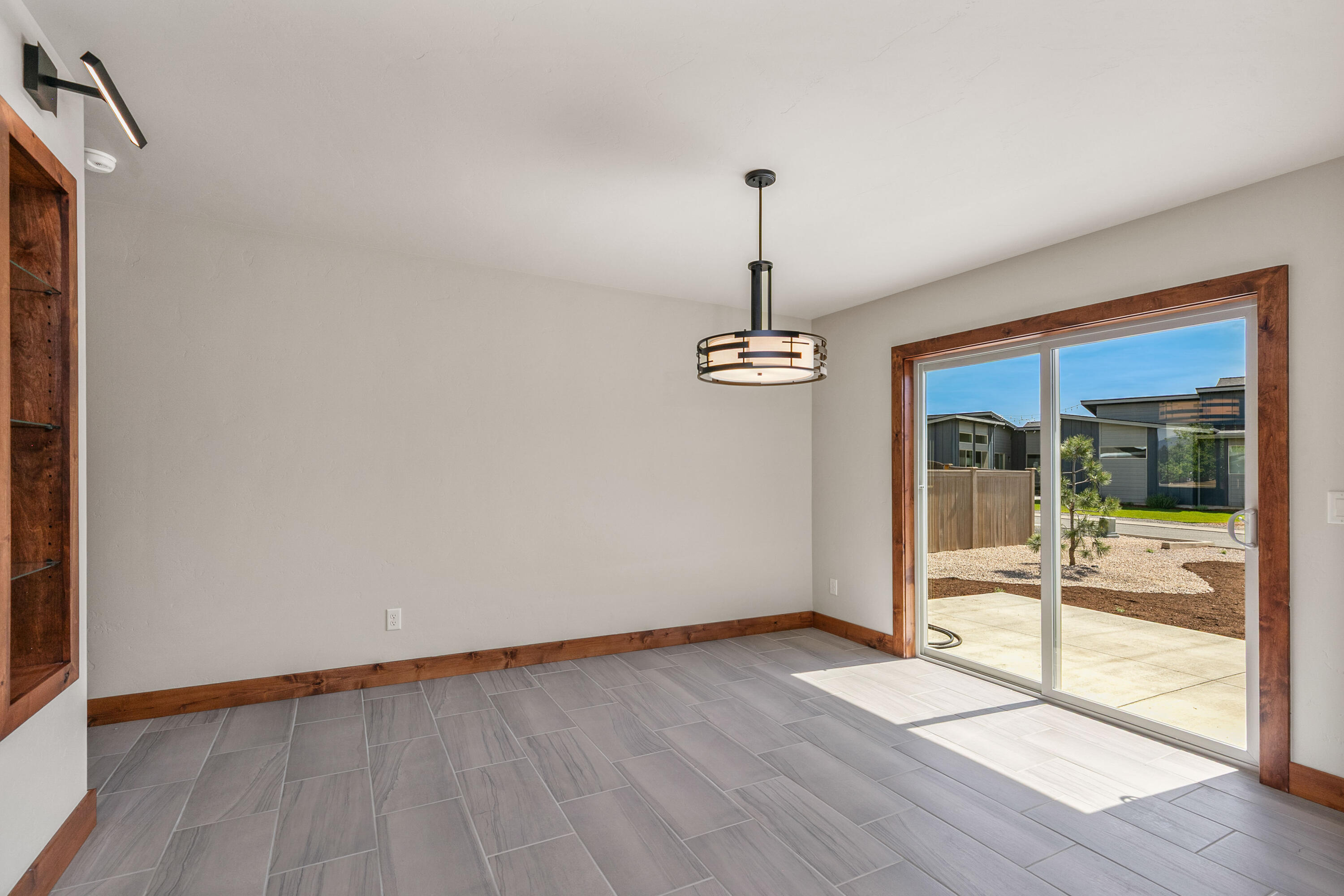 1472 Northeast Hudspeth Road Prineville, OR 97754 - Photo 9 of 26 a view of empty room with wooden floor and window