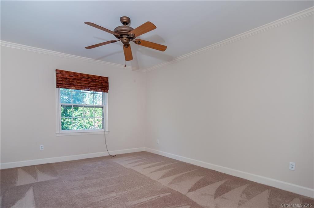 5945 Quail Hollow Road, Unit A Charlotte, NC 28210 - Photo 13 of 19 a view of an empty room with a window