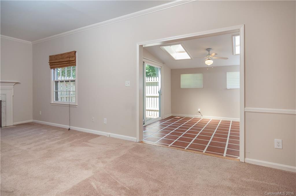 5945 Quail Hollow Road, Unit A Charlotte, NC 28210 - Photo 4 of 19 an empty room with windows