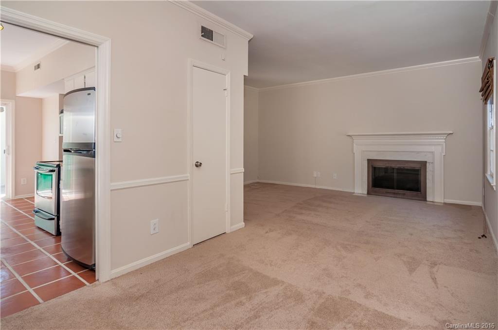 5945 Quail Hollow Road, Unit A Charlotte, NC 28210 - Photo 5 of 19 an empty room with fireplace