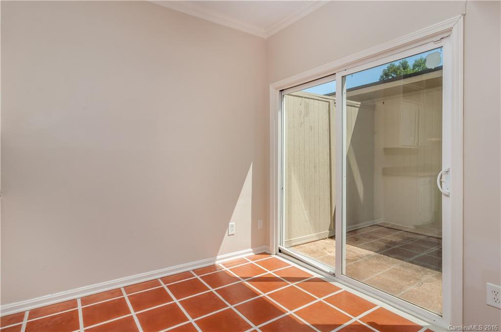 5945 Quail Hollow Road, Unit A Charlotte, NC 28210 - Photo 10 of 19 a bathroom with a glass shower door