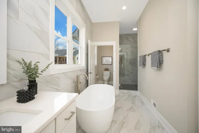 a kitchen with stainless steel appliances a sink stove and cabinets