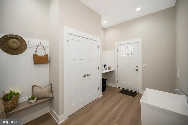 a bathroom with a granite countertop double vanity sink and mirror