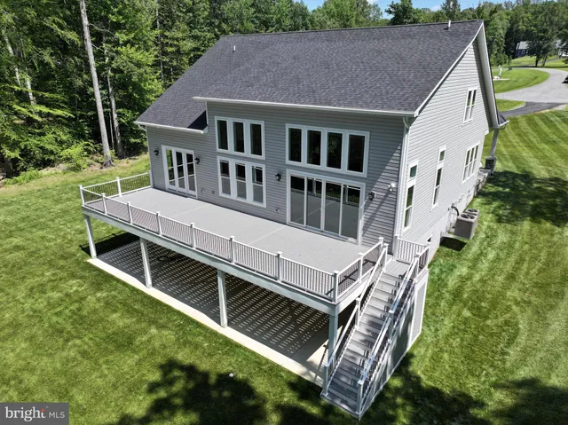 a aerial view of a house with a yard