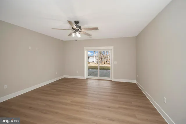 a view of a patio with table and chairs and potted plants