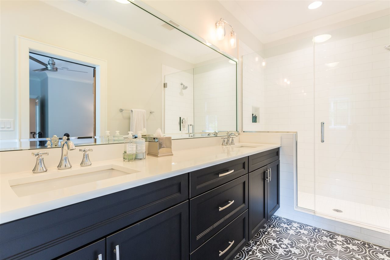 1613 10th Avenue Raleigh, NC 27607 - Photo 27 of 30 a bathroom with a double vanity sink and a mirror