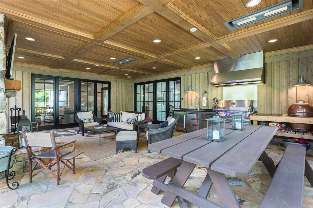 1613 10th Avenue Raleigh, NC 27607 - Photo 5 of 30 a outdoor space with lots of tables a large window and chairs