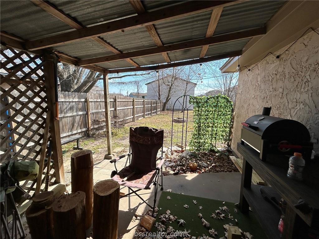 1504 Pine Ridge Drive, Unit A College Station, TX 77840 - Photo 12 of 15 a view of a chairs and table in a patio