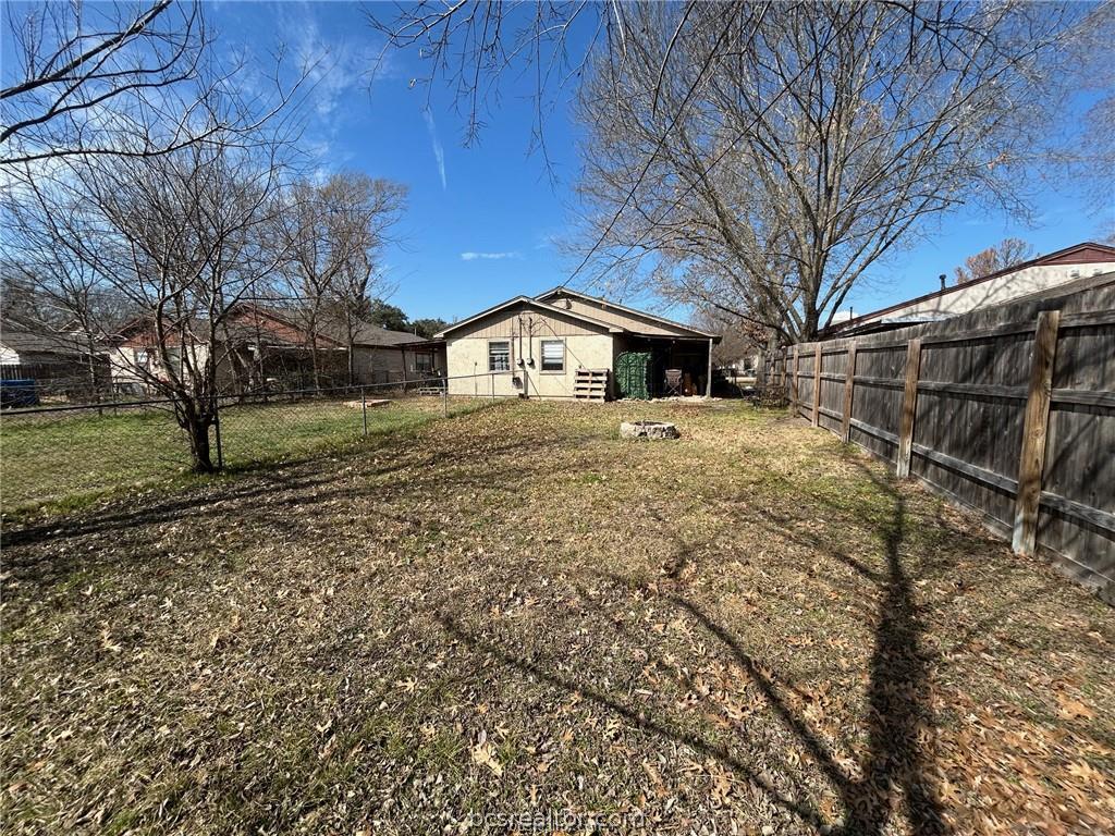 1504 Pine Ridge Drive, Unit A College Station, TX 77840 - Photo 13 of 15 a front view of a house with a yard