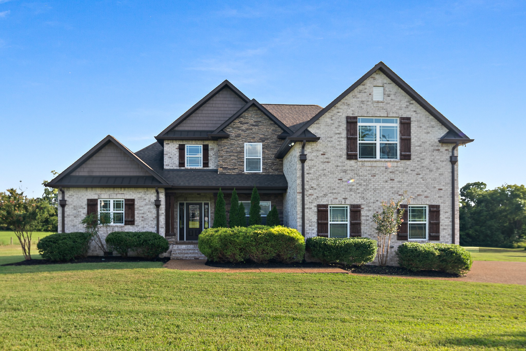 330 Bates Road Lebanon, TN 37087 - Photo 1 of 53 a front view of a house with yard and green space