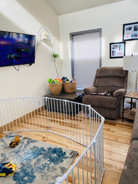 562 Spring Valley Parkway Spring Creek, NV 89815 - Photo 7 of 29 a bedroom with furniture and a window