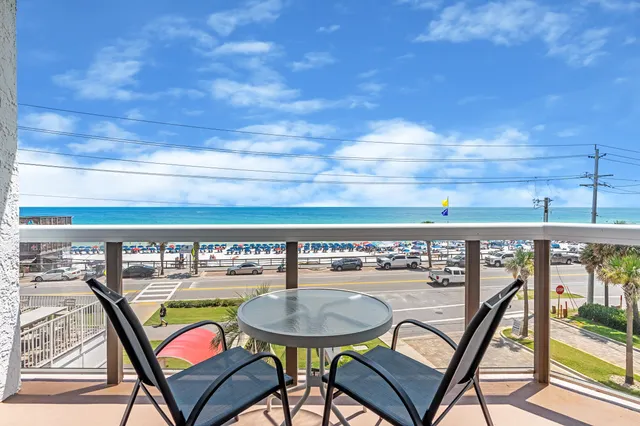 a view of a chairs and table in patio