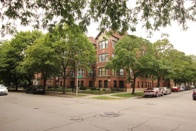 a city street lined with buildings and trees
