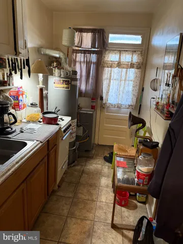 a kitchen with a sink and wooden cabinets