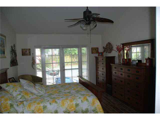 5038 Marina Circle Boca Raton, FL 33486 - Photo 11 of 19 a bedroom with furniture and a window