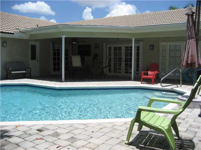 5038 Marina Circle Boca Raton, FL 33486 - Photo 15 of 19 front view of a house with a yard