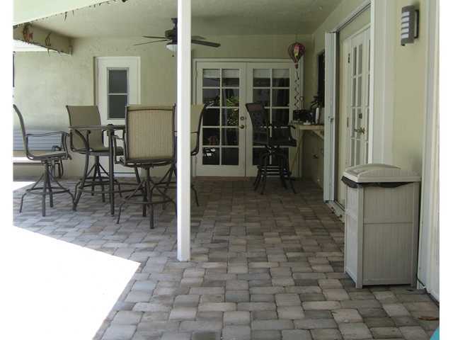 5038 Marina Circle Boca Raton, FL 33486 - Photo 18 of 19 a view of a entryway door of the house and outdoor space