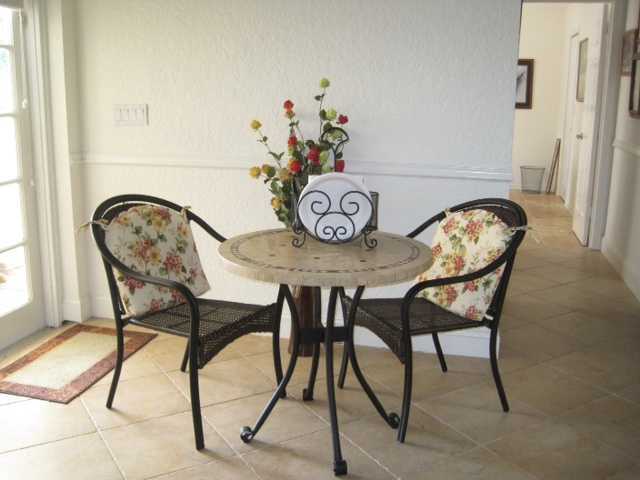 5038 Marina Circle Boca Raton, FL 33486 - Photo 8 of 19 a dining room with furniture and wooden floor