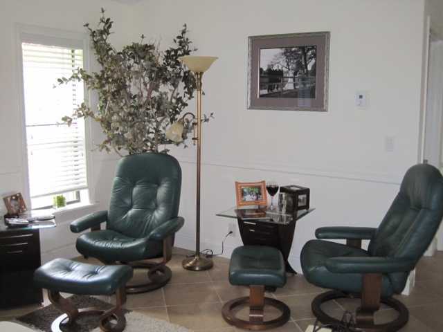5038 Marina Circle Boca Raton, FL 33486 - Photo 10 of 19 a living room with furniture and a fireplace