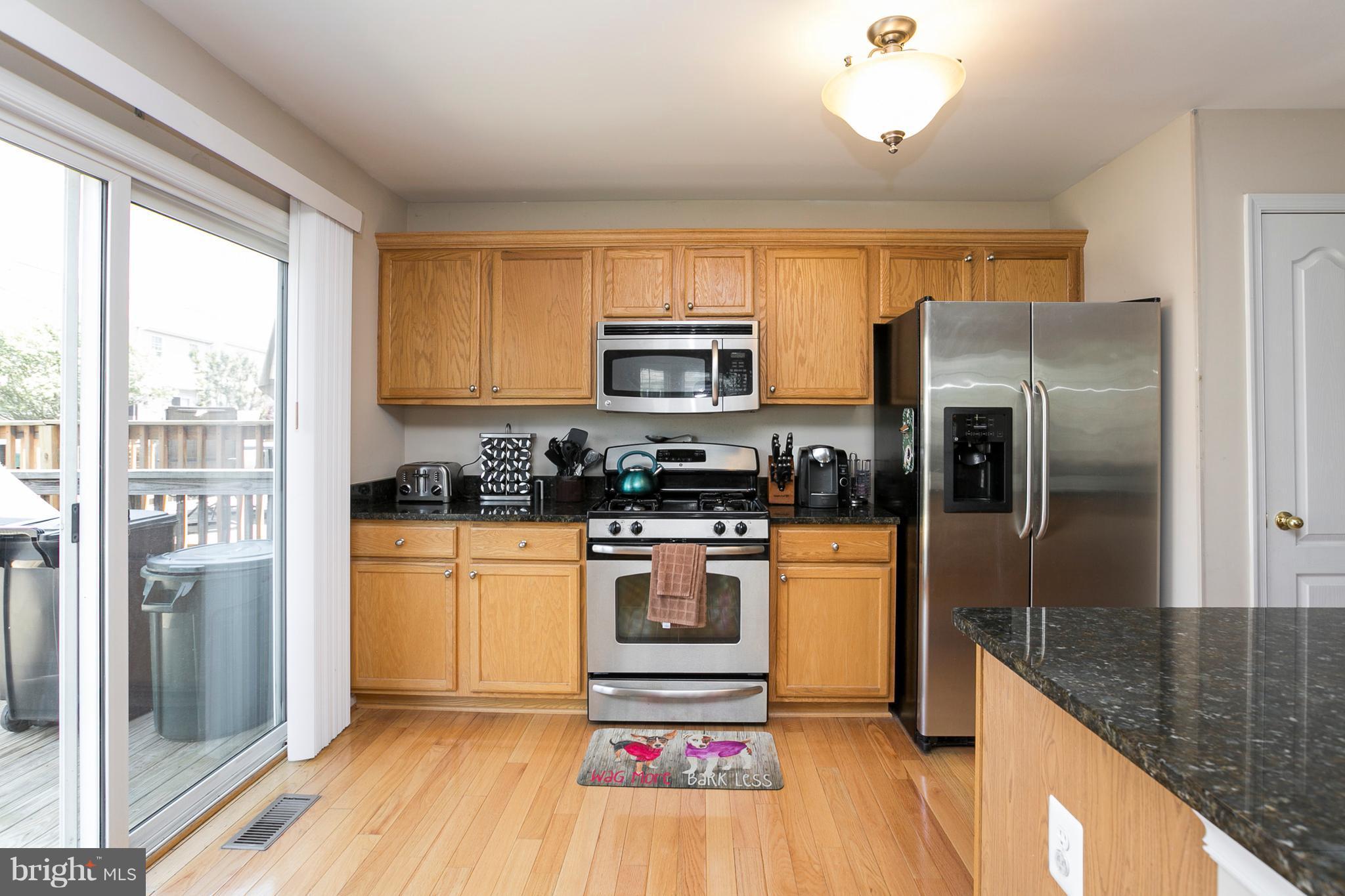 254 Pidco Road Reisterstown, MD 21136 - Photo 9 of 30 Kitchen w/slider to large deck and fenced yard