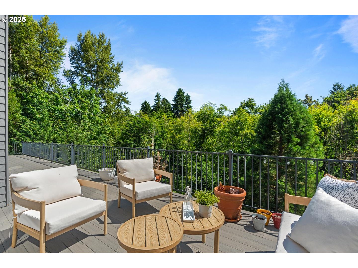 2118 Northwest Mill Pond Road Portland, OR 97229 - Photo 15 of 44 a balcony with table and chairs