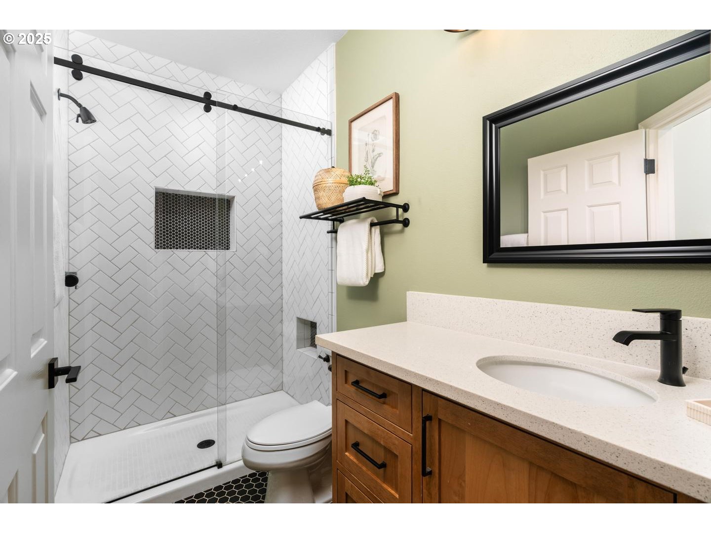 2118 Northwest Mill Pond Road Portland, OR 97229 - Photo 28 of 44 a bathroom with a sink a toilet and shower