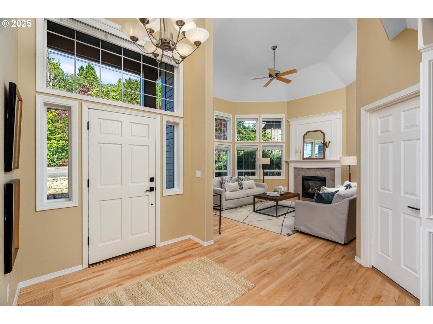 2118 Northwest Mill Pond Road Portland, OR 97229 - Photo 3 of 44 a bedroom with furniture a fireplace and windows